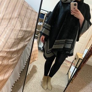 Hooded black poncho. Very comfy and flattering.